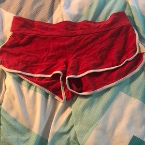 Red shorts with white stripe